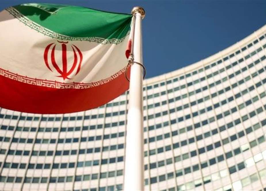 This photo taken on September 10, 2018 shows an Iranian flag fluttering outside the UN headquarters during the opening of the International Atomic Energy Agency (IAEA) Board of Governors meeting in Vienna, Austria. (Photo by AFP)