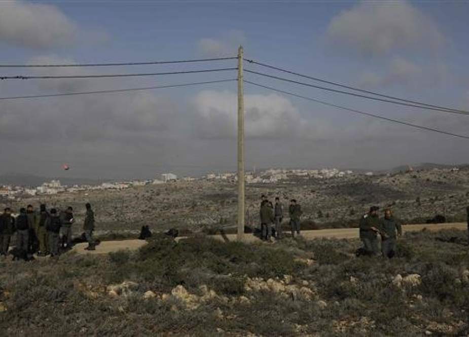 This file photo shows Israeli soldiers near the Israeli settlement of Ofra. (By AFP)