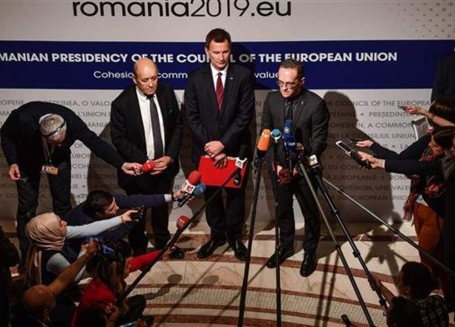 French Foreign Minister Jean-Yves Drian (L), UK Foreign Secretary Jeremy Hunt (C) and German Foreign Minister Heiko Maas give a press conference on Iran at the Informal Meeting of the EU Foreign Ministers at the National Bank of Romania headquarters in Bucharest January 31, 2019. (Photo by AFP)