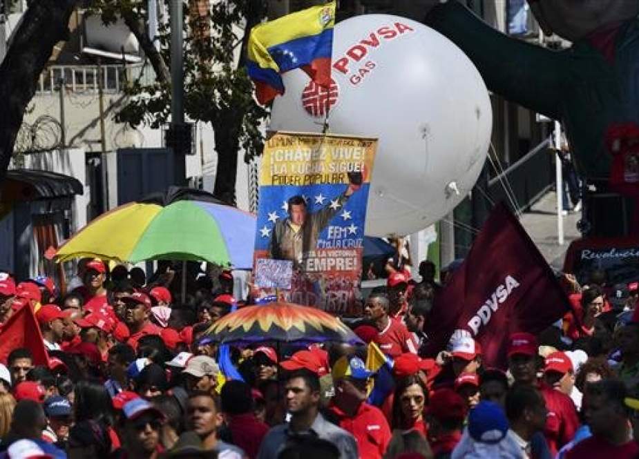 Workers from Venezuela oil industry rally to support President Nicolas Maduro in the Capital Caracas on January 31, 2019. (Photo by AFP)