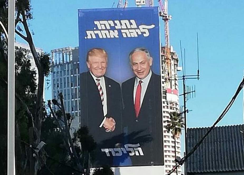 An election poster made by Netanyahu’s ruling Likud party of the two shaking hands and smiling