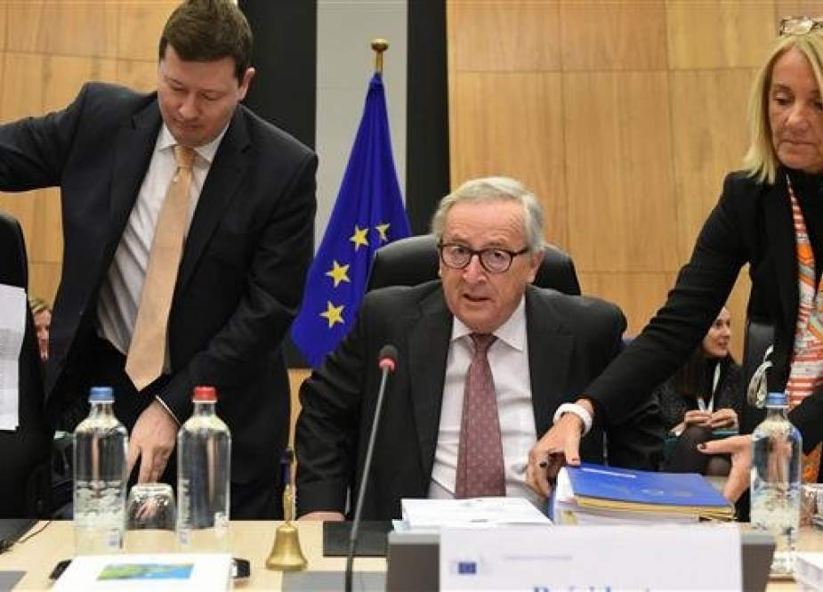 President of the European Union Commission Jean-Claude Juncker (C) sits before the start of a College of Commissioners at the EU headquarters in Brussels on January 30, 2019. (Photo by AFP)