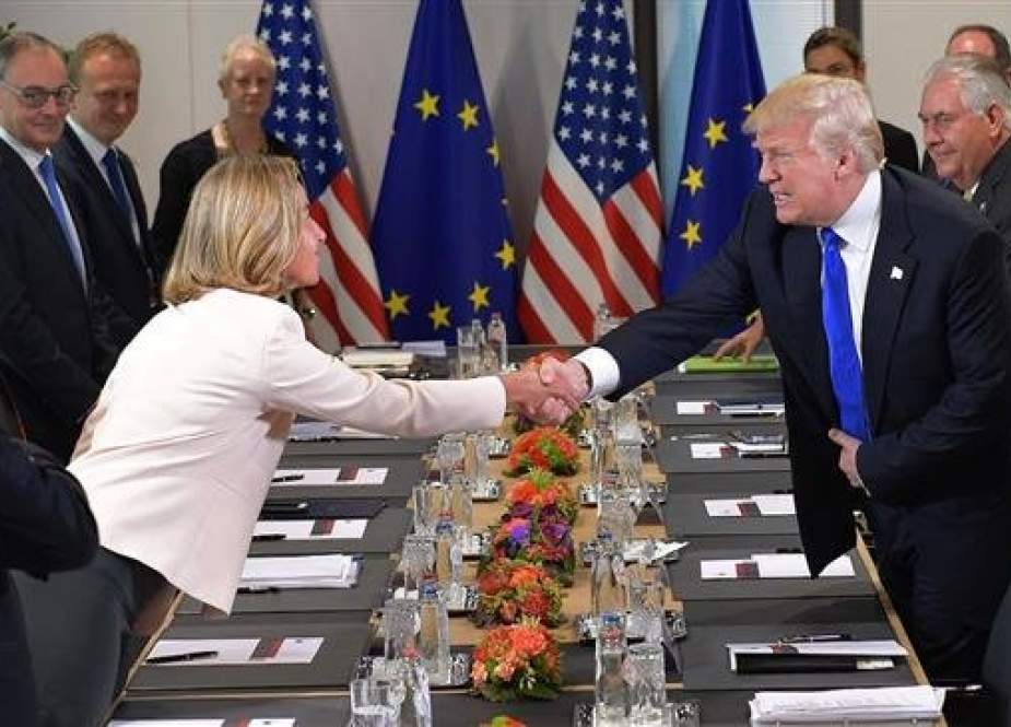 This file photo shows US President Donald Trump (R) shaking hands with EU foreign policy chief Federica Mogherini during a meeting with European Union (EU) officials at the EU Headquarters in Brussels, on May 25, 2017. (By AFP)