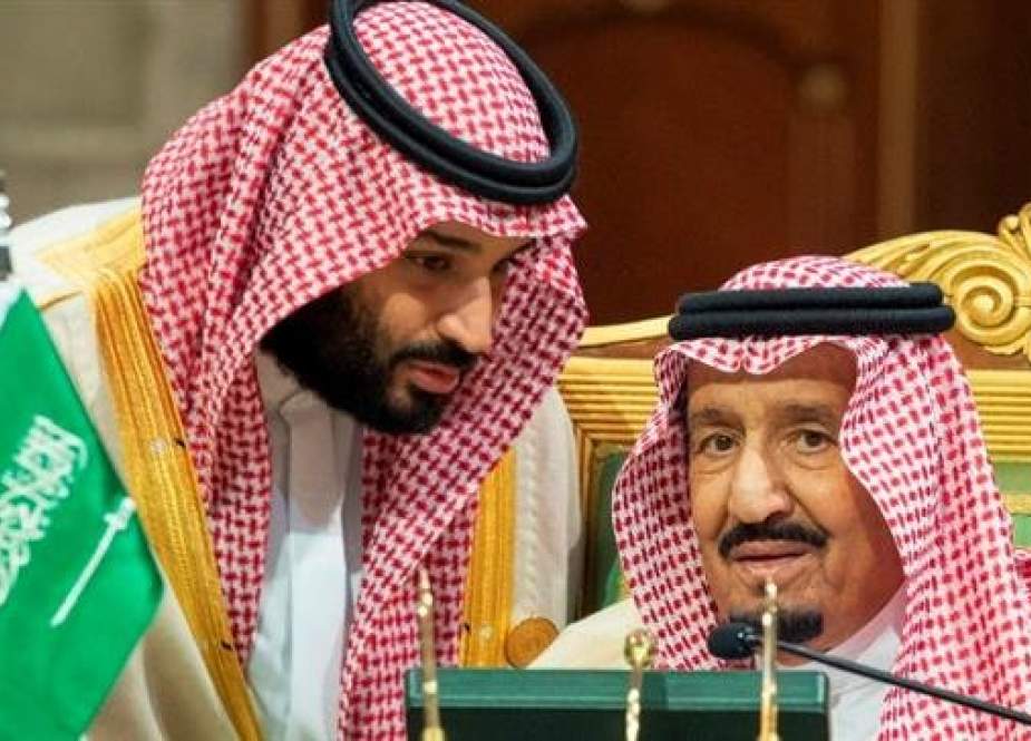 The file photo, released by the state-run Saudi Press Agency, shows Saudi Crown Prince Mohammed bin Salman, left, speaking to his father, King Salman, at a meeting of the Persian Gulf Cooperation Council in Riyadh, Saudi Arabia, on December 9, 2018. (AP)