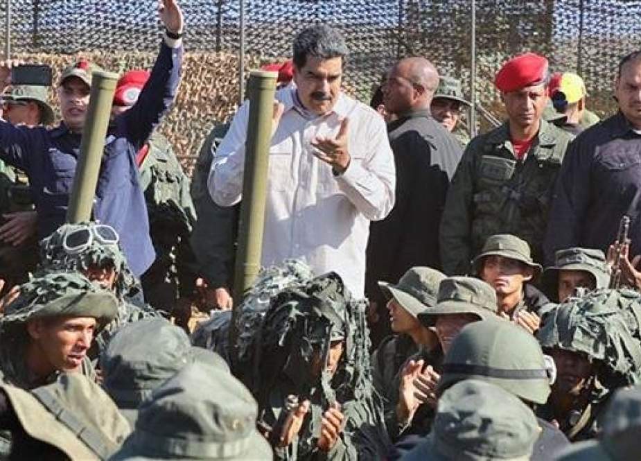 President Nicolas Maduro (C) attends military exercises at Fort Guaicaipuro in Miranda state, Venezuela, on February 10, 2019. (Photo by AFP)