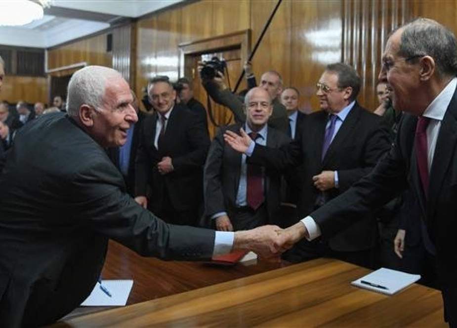 Russian Foreign Minister Sergei Lavrov (R) shakes hands with Fatah official Azzam al-Ahmad during a meeting with representatives of Palestinian groups and movements in Moscow for intra-Palestinian talks, February 12, 2019. (Photo by AFP)