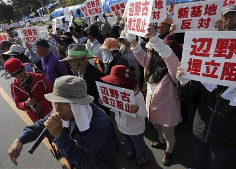 Campaigners protest against a plan for relocation of US airbase in Okinawa in Nago, Okinawa