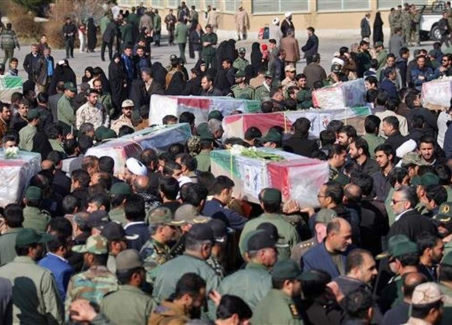 This handout picture provided by the Iranian Fars news agency on February 14, 2019 shows Iranians carrying the coffins of victims of a suicide car bombing on IRGC forces in southeastern Iran the day before, upon their arrival at an airport in Isfahan. (Photo by AFP)