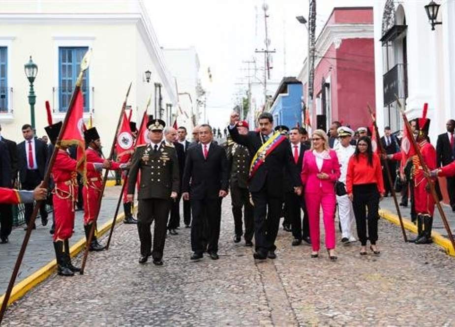 This handout file picture, released by the Venezuelan presidency, shows Venezuela’s President Nicolas Maduro (C) leading a commemorative event to mark the Bicentennial of the Angostura Congress at the Miraflores Palace in Caracas, Venezuela, on February 15, 2019. (Via AFP)