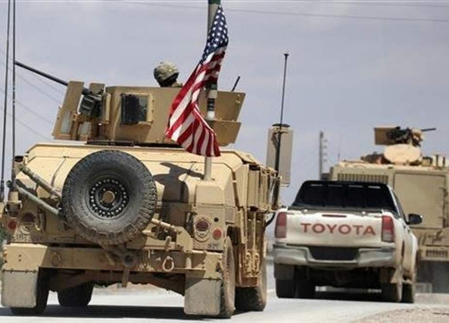 US flag flutters on a military vehicle in Manbij countryside, Syria.jpg