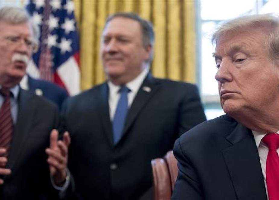 US National Security Adviser John Bolton (L) speaks to Secretary of State Mike Pompeo (C) and President Donald Trump, in the Oval Office of the White House in Washington, February 7, 2019. (Photo AP)