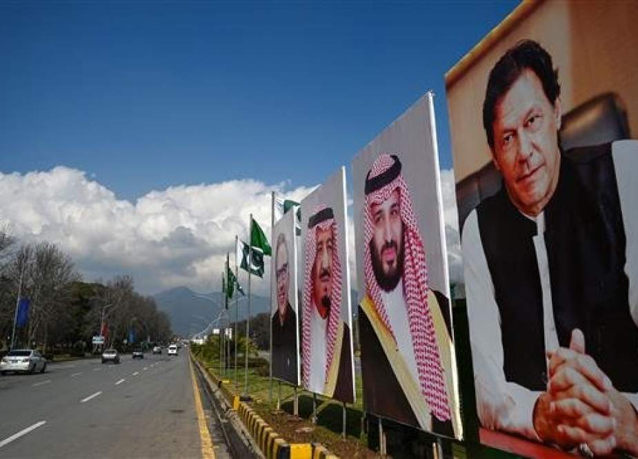 Billboards showing portraits of Saudi Arabian Crown Prince Mohammed bin Salman (2R) and Prime Minister Imran Khan (R) are displayed on a roadside in the capital Islamabad on February 15, 2019. (Photo by AFP)