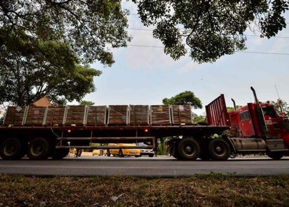 A truck loaded with humanitarian aid for Venezuela drives towards the Tienditas Bridge in Cucuta, Colombia, on the border with Tachira, Venezuela, on February 16, 2019. (AFP)