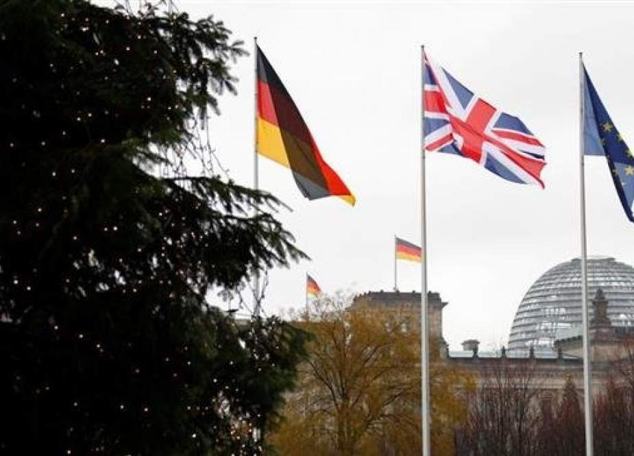 File Photo shows German, British and EU flags fluttering in front of the Reichstag building in Berlin, Germany December 11, 2018. (Photo by Reuters)