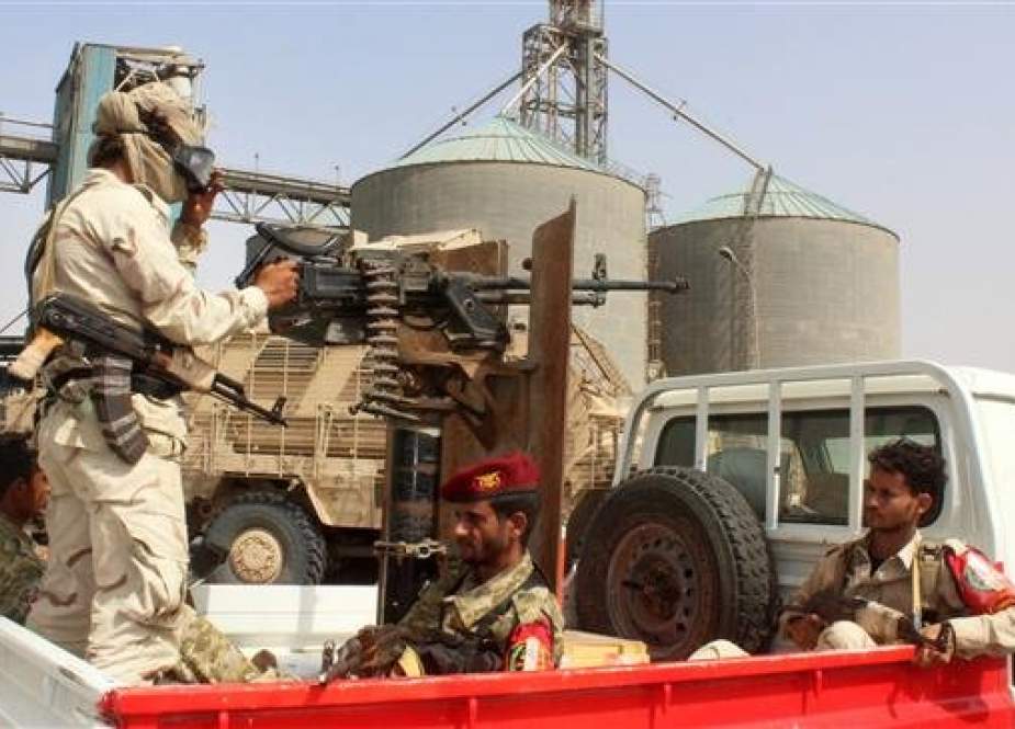 Soldiers with a military coalition in Yemen backed by Saudi Arabia and the United Arab Emirates stand guard at a facility in Yemen
