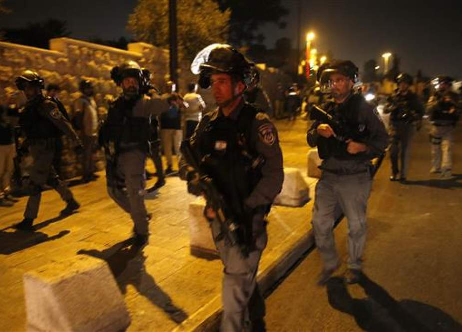 Israeli forces patrol near an entrance to the Al-Aqsa compound in Jerusalem al-Quds. (Photo by AFP)