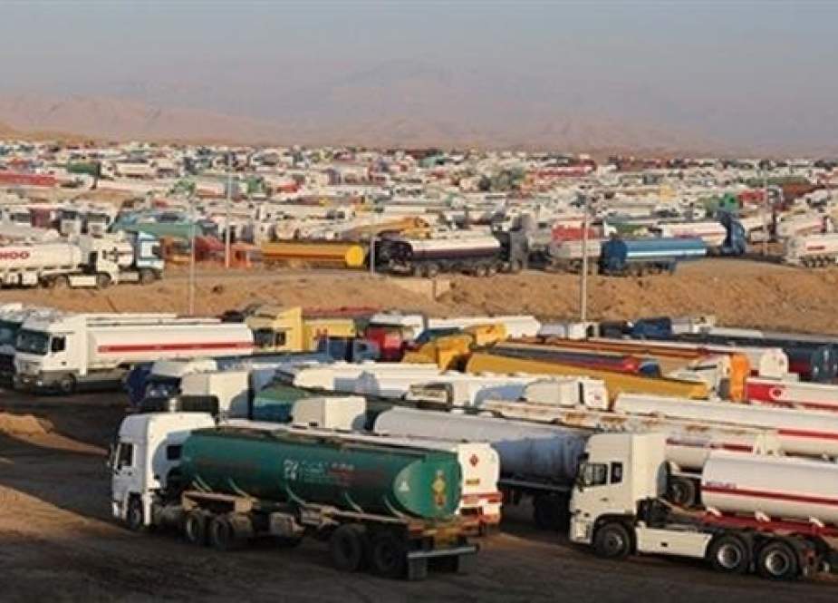 Hundreds of tanker trucks wait to cross into Iran in one of several lots near the Parviz Khan border crossing in Diyala province, Nov. 6, 2013. (Photo by Iraq Oil Report)