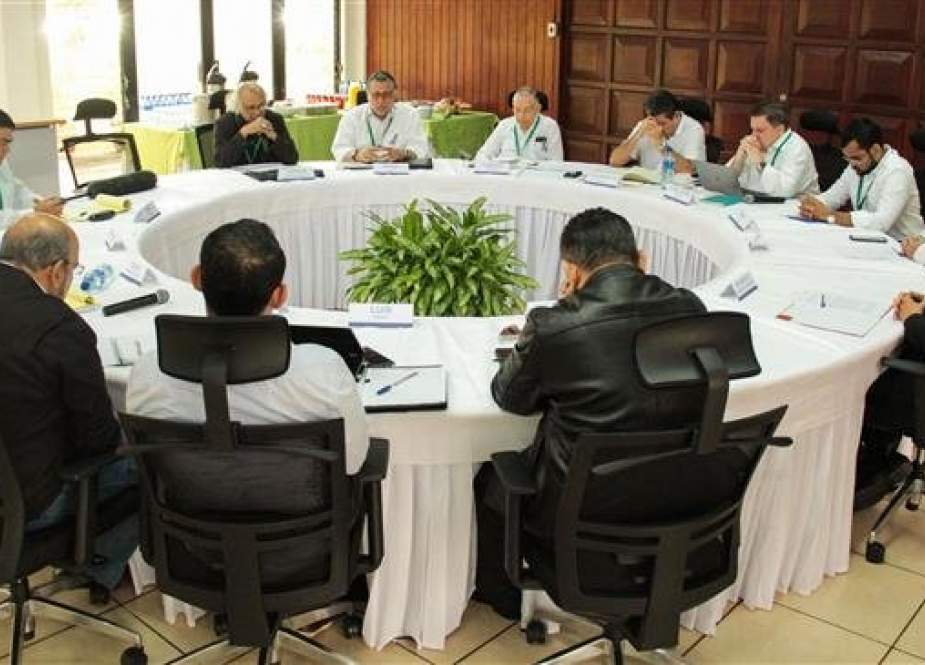 Government representatives, members of the opposition, and Catholic Church mediator Cardinal Leopoldo Brenes (C-L) take part in talks to tackle Nicaragua’s political crisis, in Managua, on February 27, 2019. (Photo by AFP)