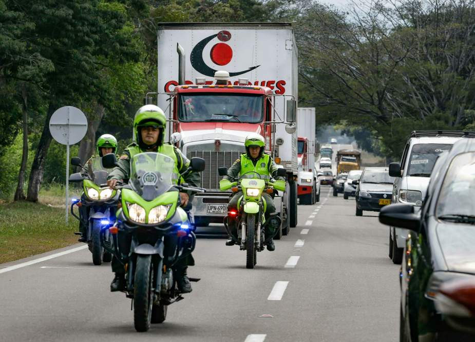 Trucks carrying US-provided aids drive towards the Colombia-Venezuela border