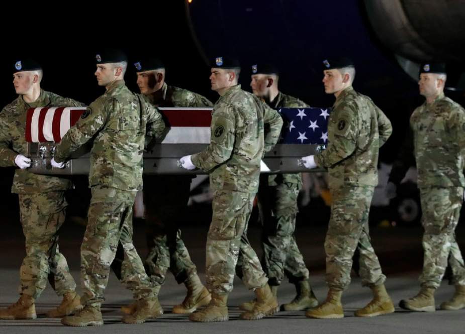 US armed forces carry a case containing the remains of a US soldier recently killed in Afghanistan, during a ceremony in Dover, Delaware, on November 27, 2018. (Getty Images)