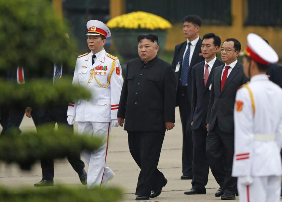 North Korean leader Kim Jong-un (C) attends a wreath laying ceremony at the Ho Chi Minh mausoleum in Vietnam