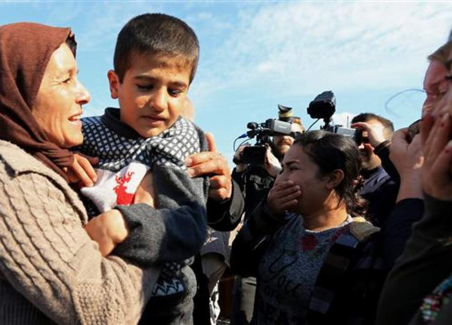 Freed Izadi women, children reunite with families in northern Iraq