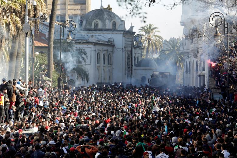 People gather during a protest against President Abdelaziz Bouteflika's plan to extend his 20-year rule by seeking a fifth term in April elections in Algiers, March 1