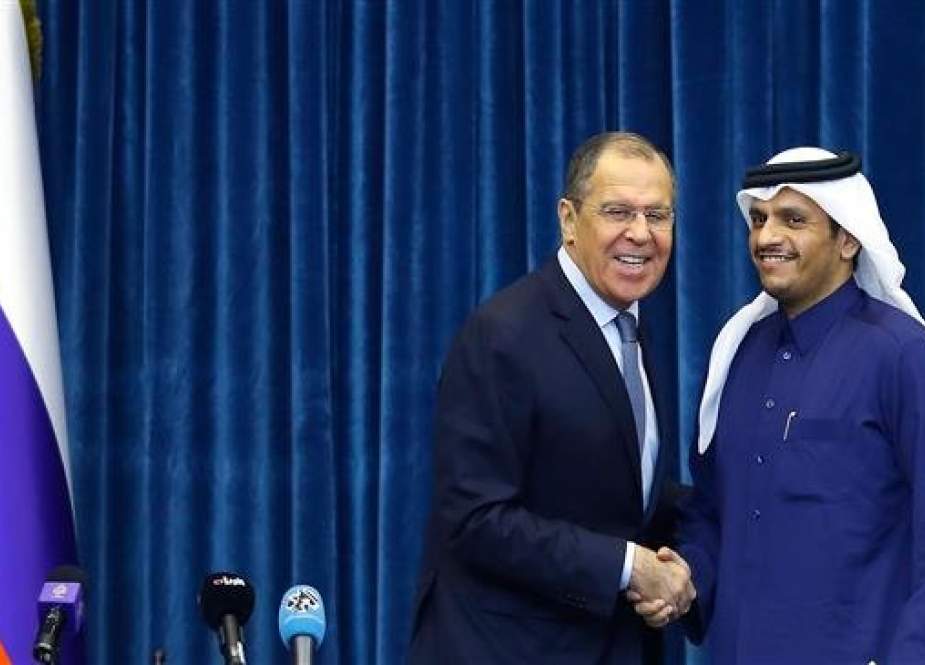 Qatari Foreign Minister Mohammed bin Abdulrahman Al Thani, right, shakes hands with his Russian counterpart, Sergei Lavrov, in a press conference at the Amiri Diwan Palace in the capital Doha on March 4, 2019. (Photo by AFP)