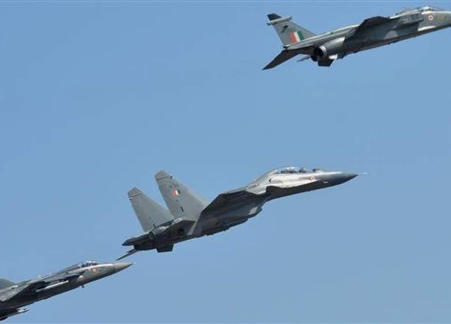 Indian Air Force aircrafts Sukhoi Su30 MKI (C), Light Combat Aircraft TEJAS (L), and a SEPECAT Jaguar (R) fly during the inaugural day of the five-day Aero India 2019 airshow at the Yelahanka Air Force station in Bangalore on February 20, 2019. (Photo by AFP)