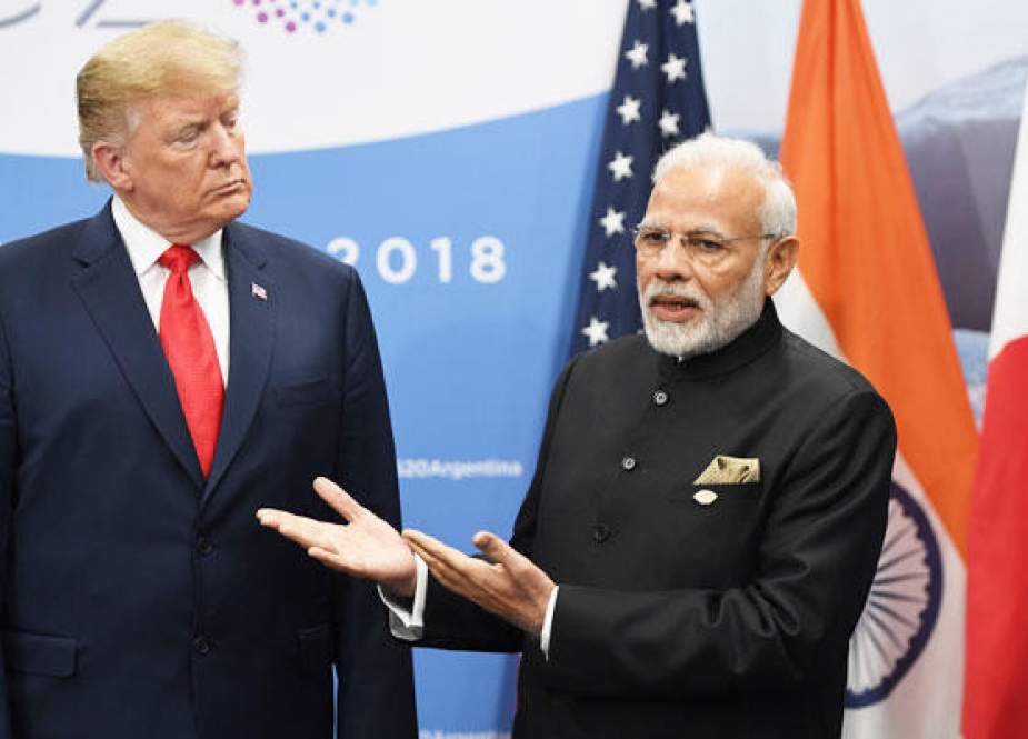 In this file photo taken on November 30, 2018, US President Donald Trump listens to India