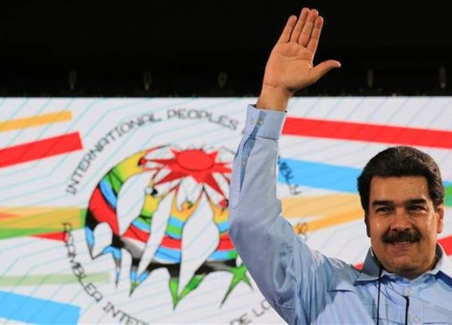 A handout picture released by the Venezuelan presidency shows Venezuela’s President Nicolas Maduro waving during the celebration of the International Peoples’ Assembly, in Caracas, on February 26, 2019. (Via AFP)