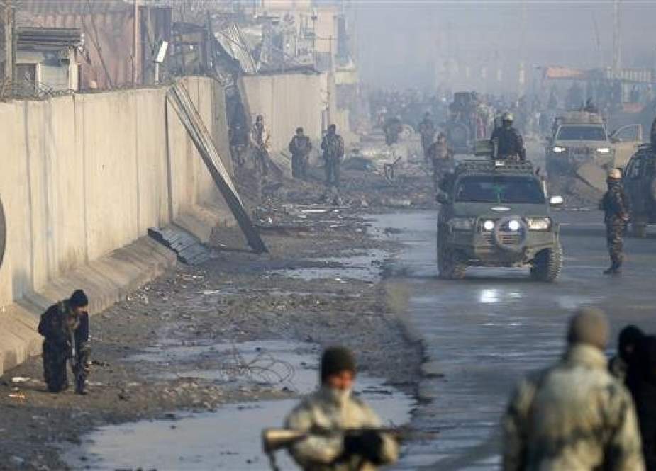 This file photo shows Afghan security forces at the site of a powerful truck bomb attack a day after it detonated near a foreign compound in Kabul, Afghanistan, on January 15, 2019. (By AFP)