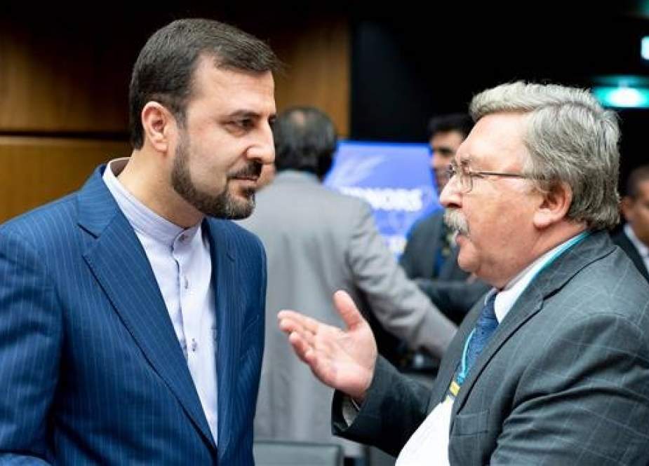 Iranian and Russian ambassadors to the International Atomic Energy Agency (IAEA), Kazem Qaribabadi (L) and Mikhail Ulyanov are seen prior to the opening of an IAEA Board of Governors’ meeting in Vienna, Austria. (Photo by AFP)