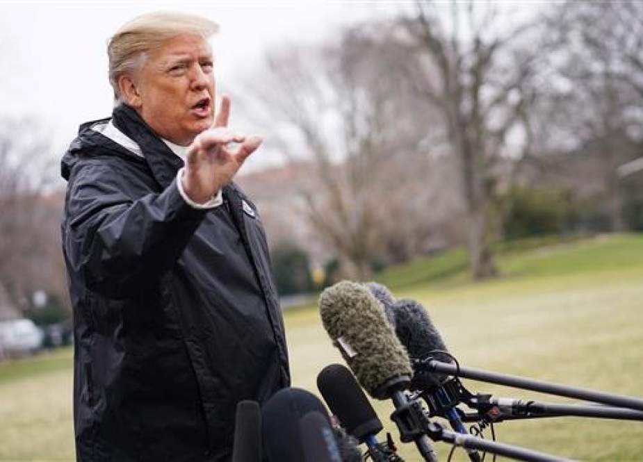 US President Donald Trump speaks to the press before boarding Marine One at the White House on March 8, 2019, in Washington, DC. (Photo by AFP)