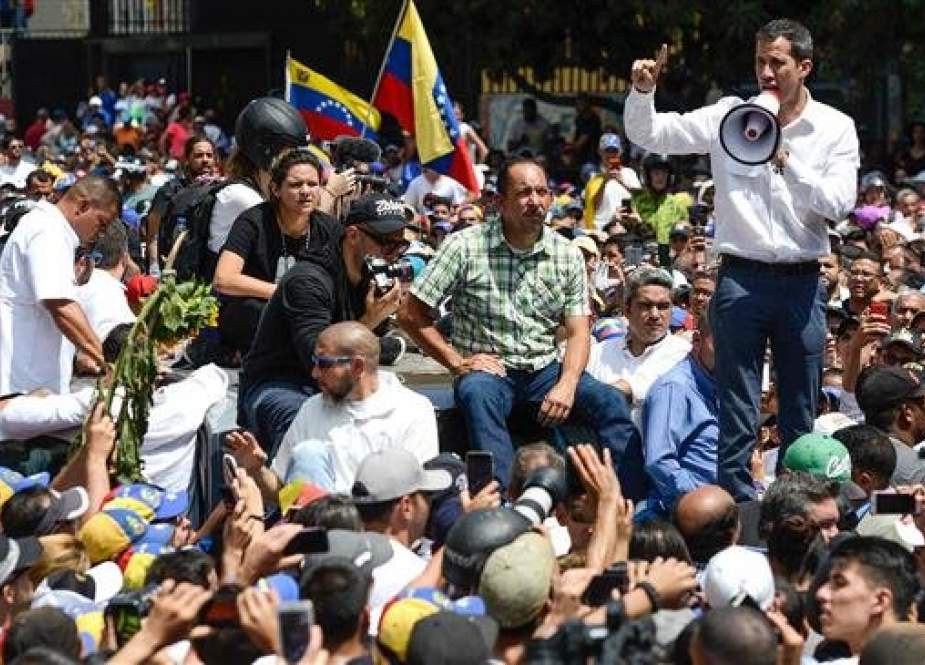Venezuelan opposition leader and self-proclaimed acting president Juan Guaido speaks during a demo in Caracas on March 9, 2019. Riot police blocked protesters as thousands of people took to the streets Saturday with tensions rising between opposition leader Juan Guaido and President Nicolas Maduro after crisis-wracked Venezuela emerged from the chaos of an electricity blackout.(AFP)