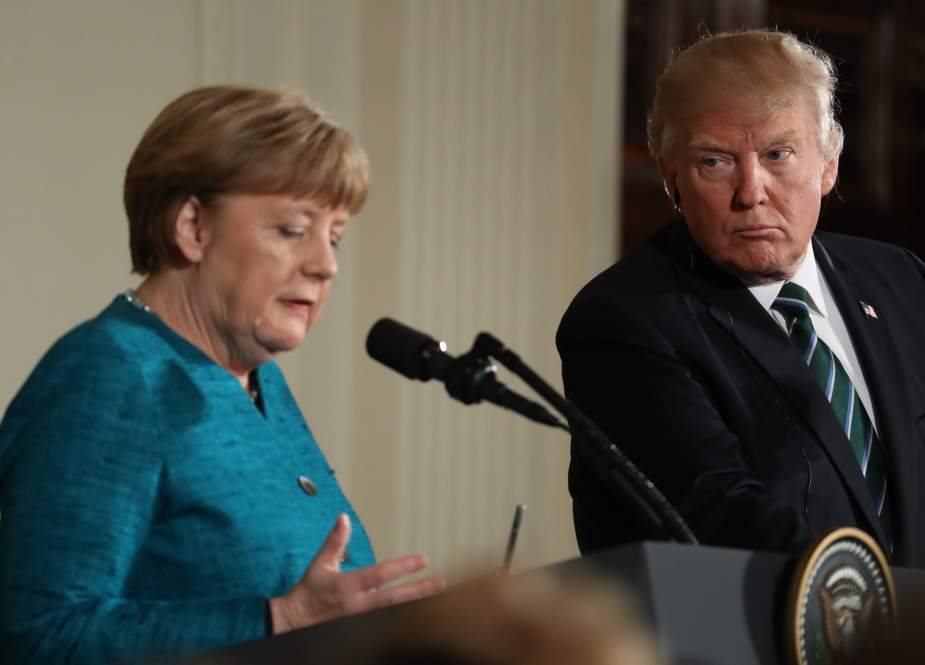 US President Donald Trump looks at German Chancellor Angela Merkel as she speaks during a joint news conference in the East Room of the White House in Washington, on March 17, 2017.