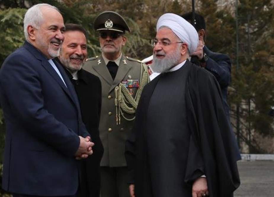 A handout picture provided by the Iranian Presidency on February 27, 2019 shows Foreign Minister Mohammad Javad Zarif (L) speaking with President Hassan Rouhani (R) in Tehran, Iran. (Via AFP)