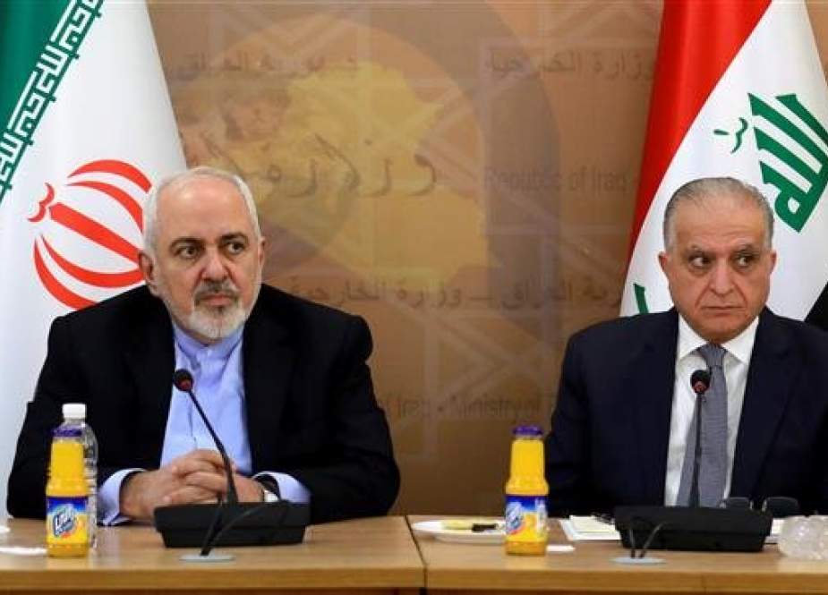 Iranian Foreign Minister Mohammad Javad Zarif, left, meets with Iraqi Foreign Minister Mohamed Ali al-Hakim in Baghdad, Iraq, on March 10, 2019. (Photo by Reuters)
