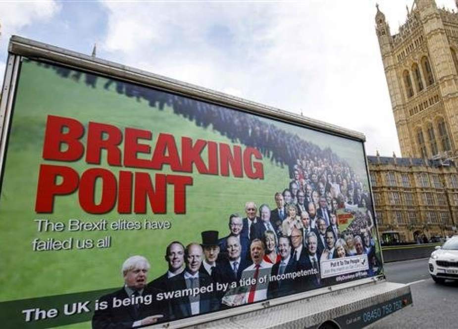 A van with a billboard entitled “Breaking Point” and aimed at holding the “Brexit Elite” to account, is pictured outside the Houses of Parliament in central London on March 7, 2019. (Photo by AFP)