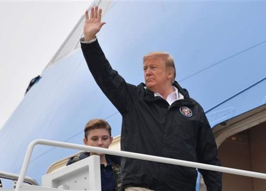 US President Donald Trump waves as he boards Air Force One at Joint Base Andrews, in Maryland, on March 8, 2019 in Washington, DC. (Photo by AFP)