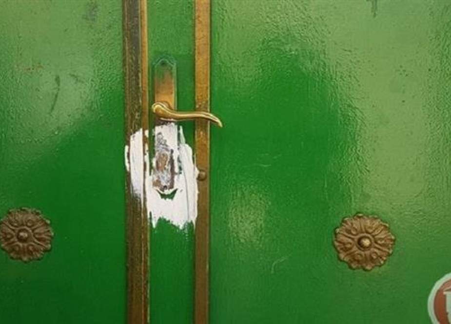An adhesive substance is spread over the lock area of the door of Sheikh Makki Mosque purportedly by Israeli settlers in the occupied Jerusalem al-Quds, March 11, 2019. (Photo by Ma’an)
