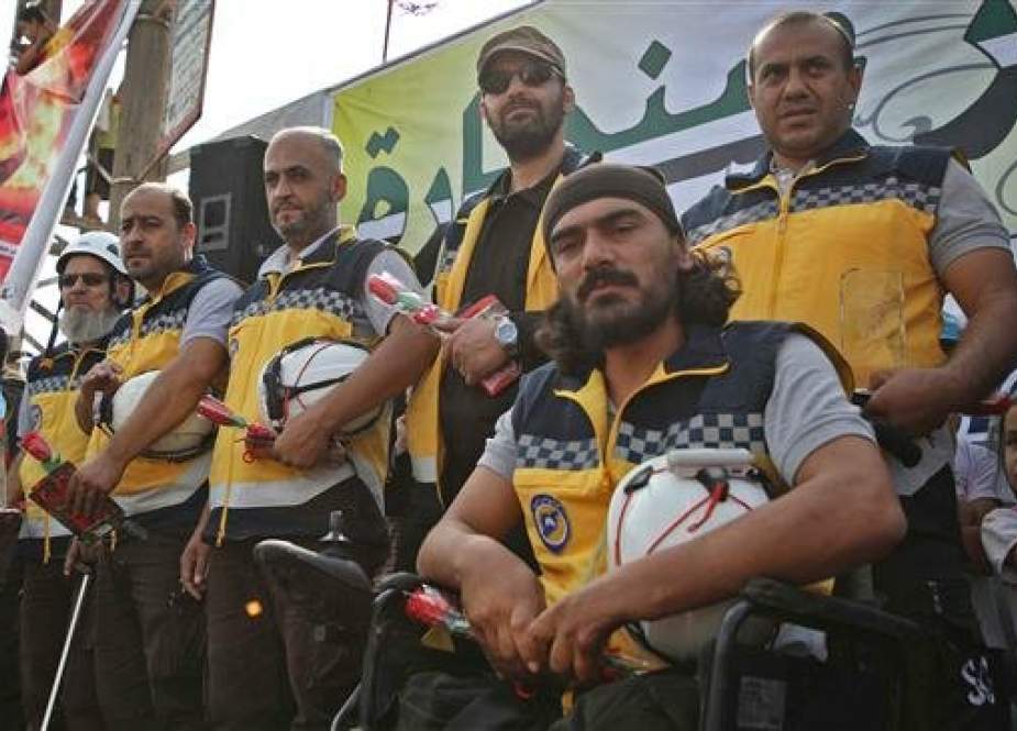 Members of the White Helmets attend a gathering and demonstration in Anjara in the western countryside of Aleppo.jpg