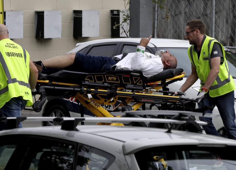 Ambulance workers take a man from outside a mosque in central Christchurch, New Zealand, March 15, 2019.