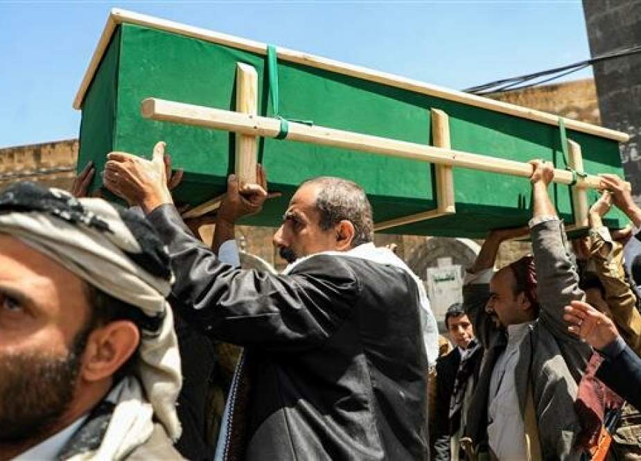 Yemeni mourners carry a coffin during a funeral in the Yemeni capital of Sana