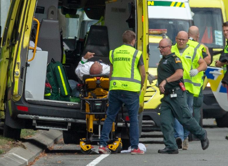 An injured person is loaded into an ambulance following a shooting at the Al Noor mosque in Christchurch.