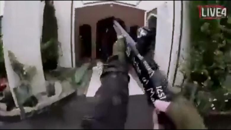 A still image taken from video circulated on social media, apparently taken by a gunman and posted online live as the attack unfolded, shows him entering a mosque in Christchurch.