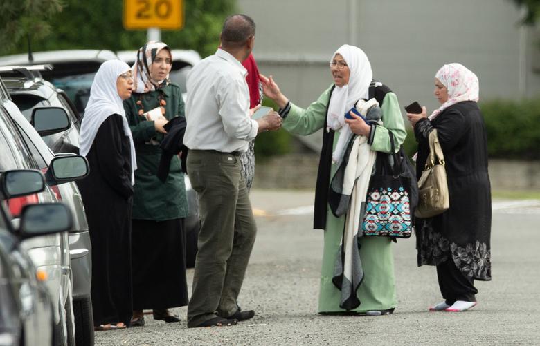 Members of a family react outside the mosque following a shooting at the Al Noor mosque in Christchurch.