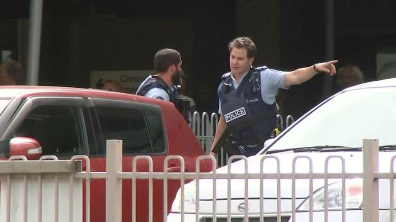 Police officers are seen after reports that several shots had been fired at a mosque, in central Christchurch.