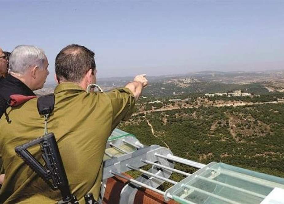 Israeli Prime Minister Binyamin Netanyahu viewing the Syrian border from a stand overlooking the occupied Golan Heights.jpg