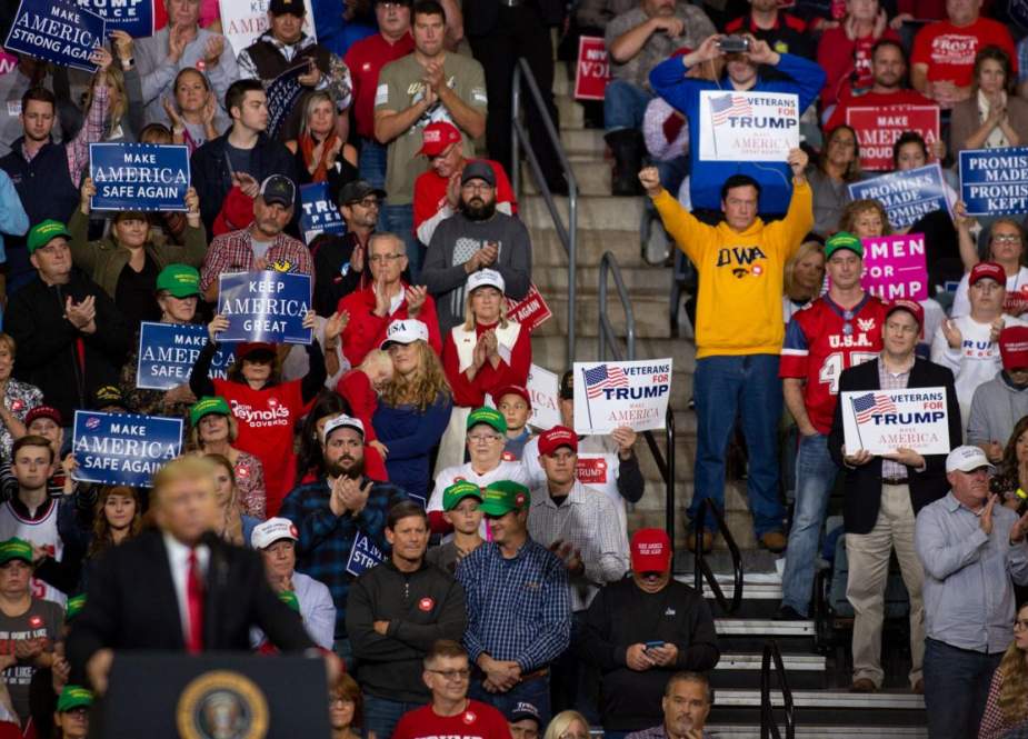 In this AFP file photo taken on October 9, 2018 supporters cheer as US President Donald Trump speaks at a "Make America Great Again" rally at the Mid-America Center in Council Bluffs, Iowa.